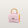 Pink handbag with a wooden handle 