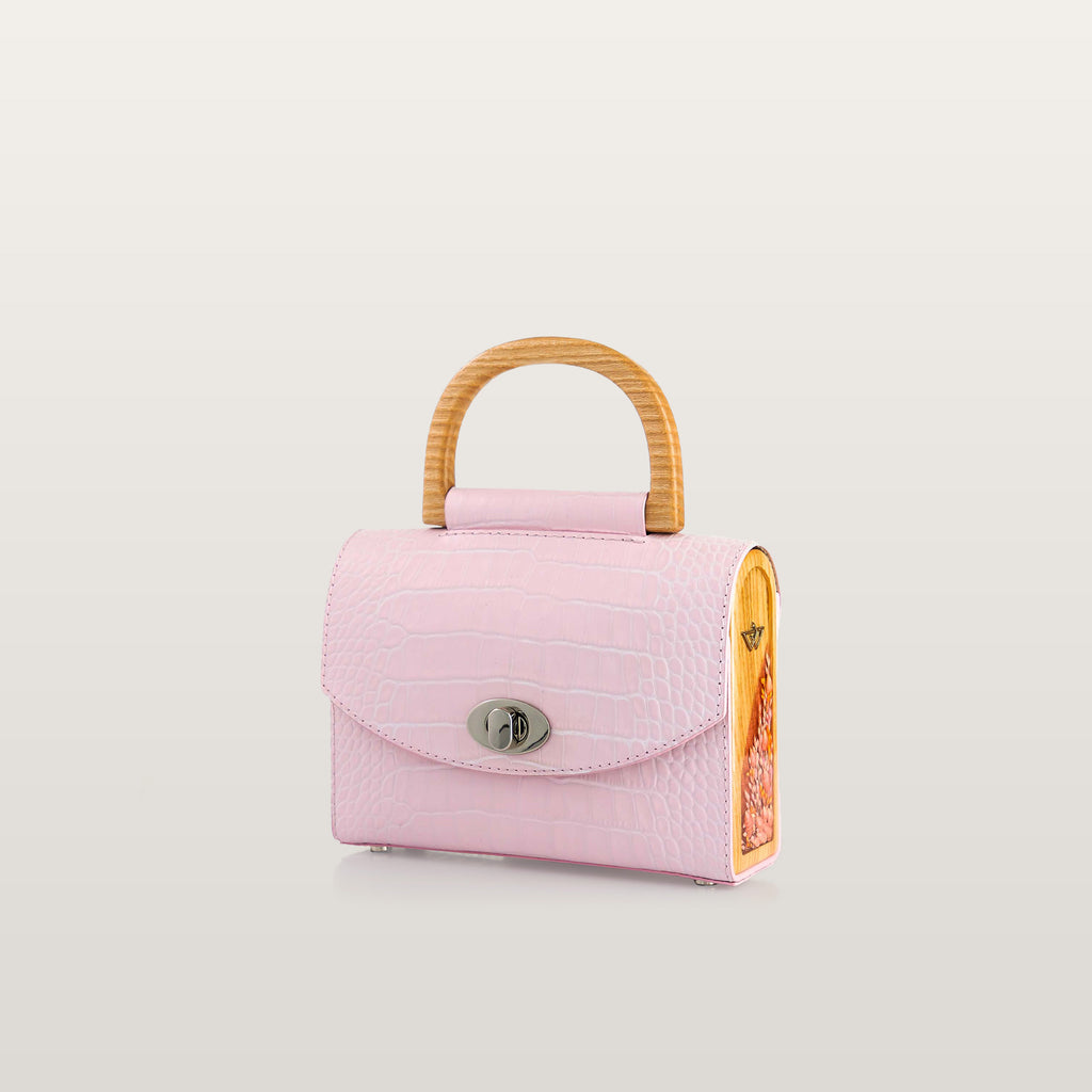 Pink handbag with a wooden handle 