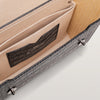 Close-up of a leather wallet with 'Blackwood' branding on a light background