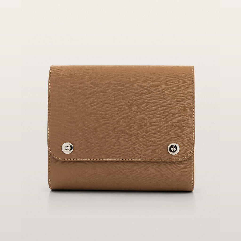 Blizzard cappuccino bag with silver buttons on a light gray background