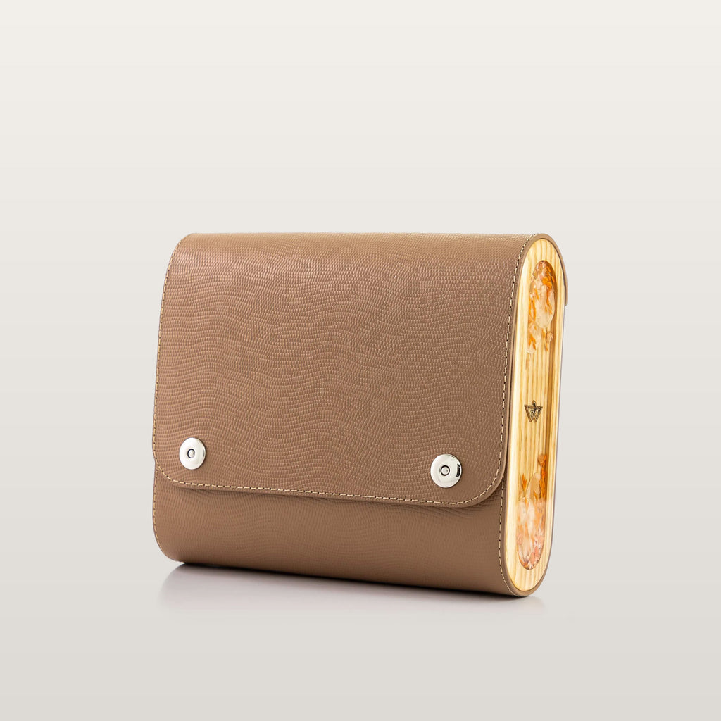 Beige handbag with wooden accents on a light gray background