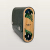 Green textured clutch with wooden panel featuring floral design on a light gray background