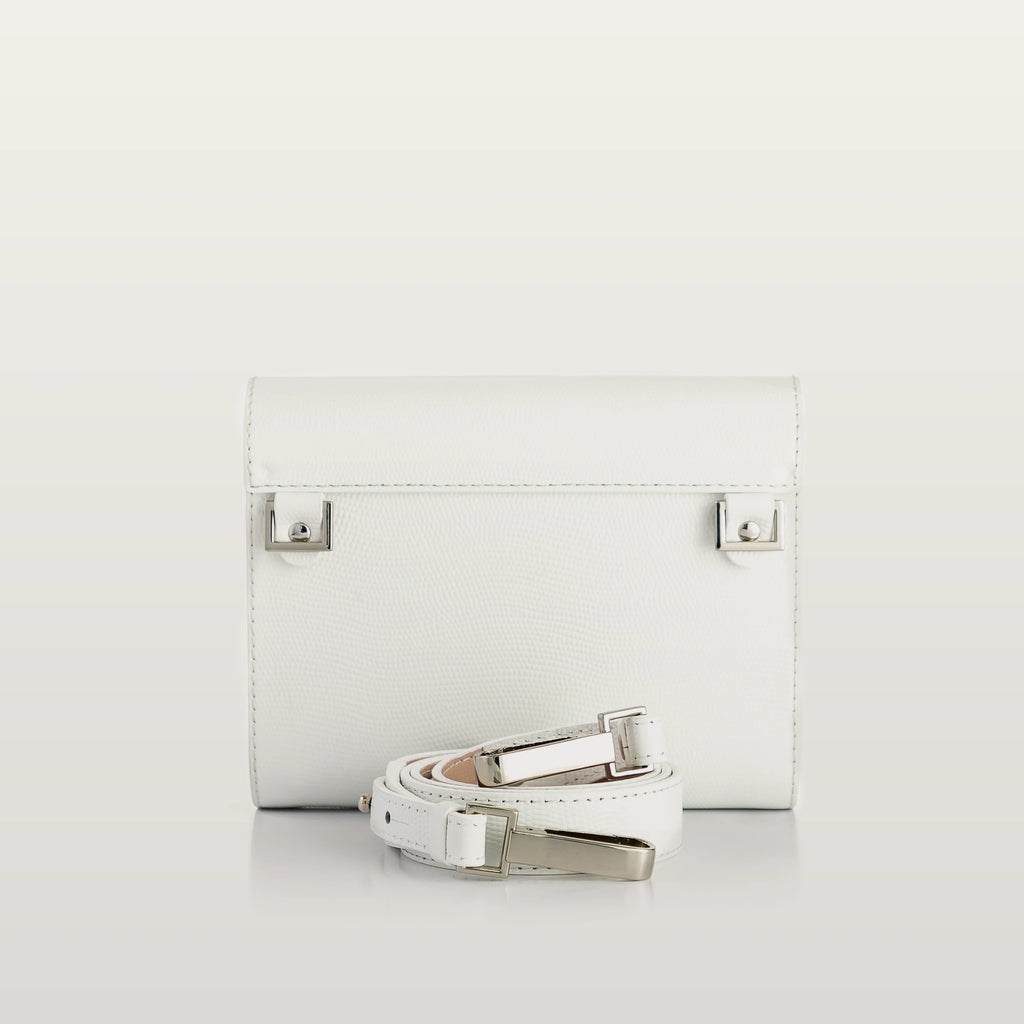 White leather clutch with matching belt on a light gray background