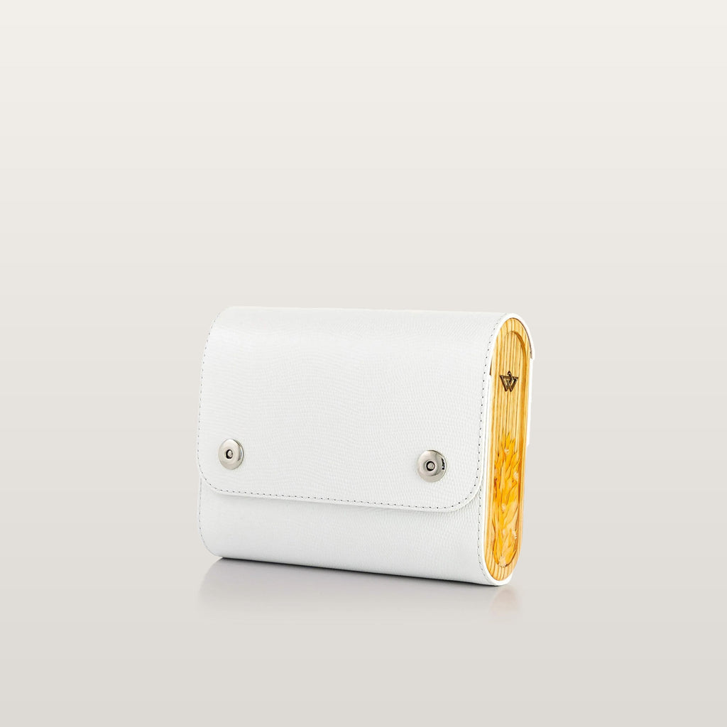 Whiteleather bag with a wooden accent on a light gray background