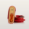 Side view of a red Blizzard handbag with natural wood inlay and textured leather