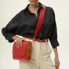 Elegant small red Blizzard bag in Saffiano leather styled in a fashion look