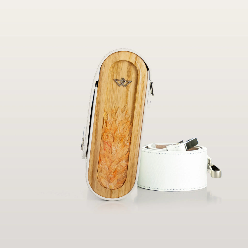 Wooden and white case with a fish design on a light gray background