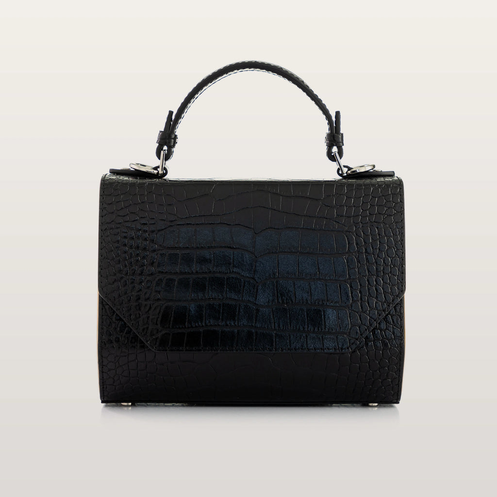 Black crocodile-patterned handbag on a light gray background
