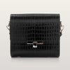 Black crocodile-patterned handbag on a light gray background