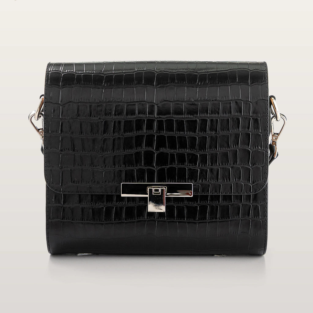 Black crocodile-patterned handbag on a light gray background