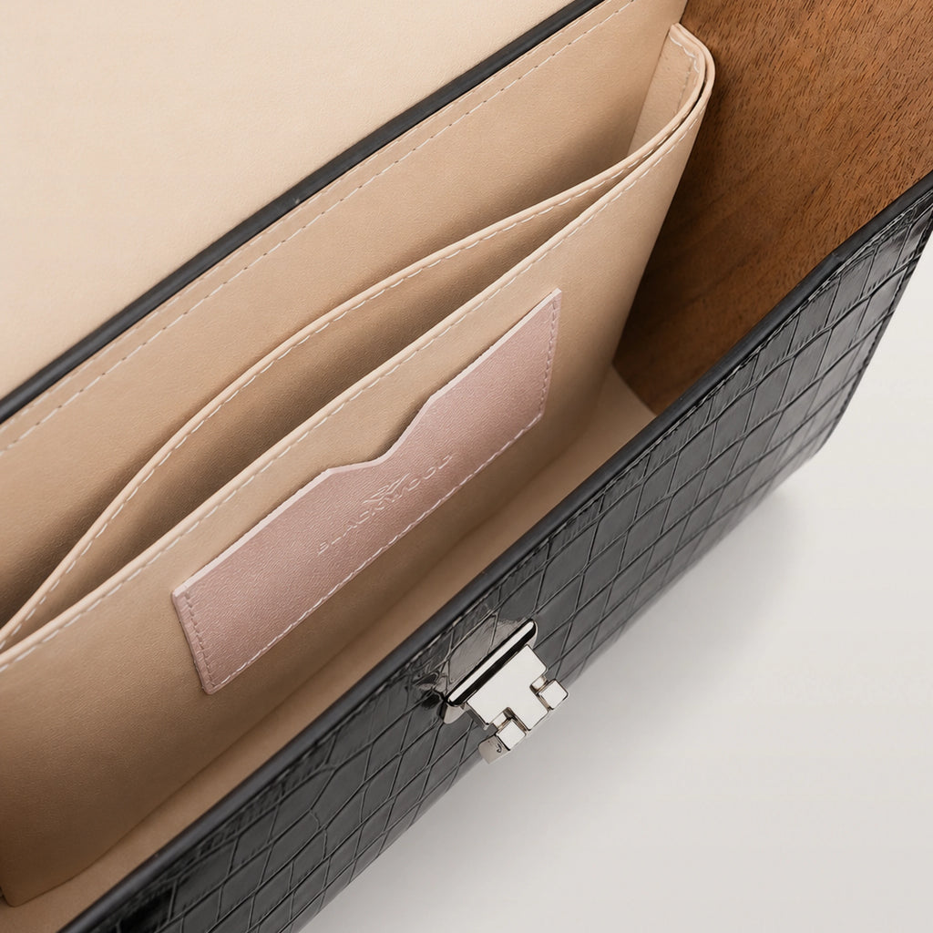 Close-up of handcrafted black croco leather and wooden side panel on BLACKWOOD Gloria bag